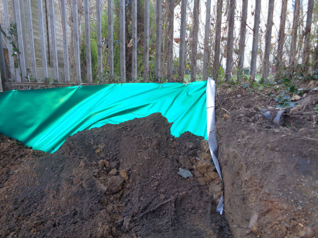 installation of root barrier membrane at development site
