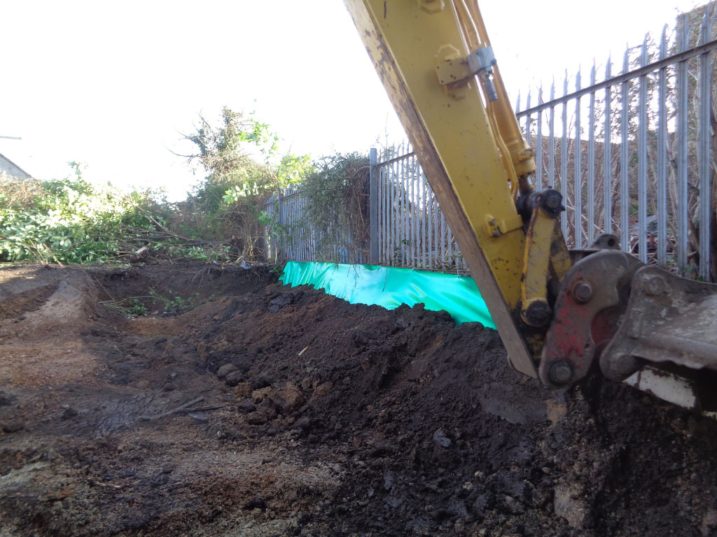 Root barrier membrane installation at building site